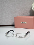 MiuMiu silver eyeglass frame with black temples and clear lenses