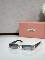 MiuMiu silver eyeglass frame with black temples and dark lenses