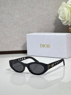 Dior sunglasses with black oval frames and dark lenses