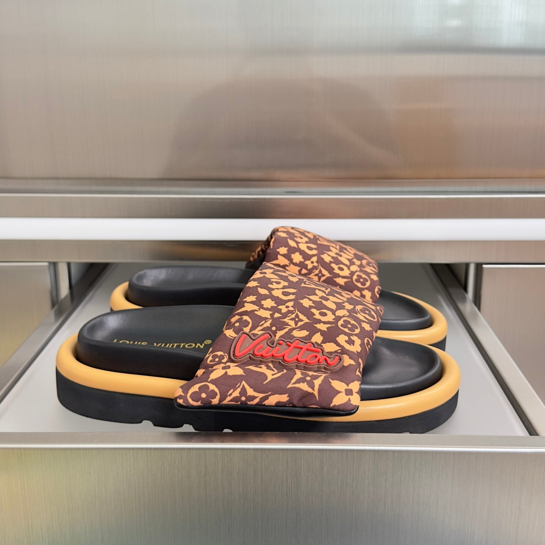 Louis Vuitton sandals: brown monogram strap, black footbed, tan platform sole