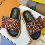 Louis Vuitton sandals in box, pair of brown monogram slides with black footbeds and tan soles