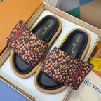 Louis Vuitton sandals in box: brown monogram slides with black footbeds and tan platform soles