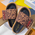 Louis Vuitton sandals: brown monogram straps with red 'Vuitton' and black footbeds, tan trim