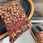 Louis Vuitton sandal strap: brown monogram fabric with red 'Vuitton' lettering