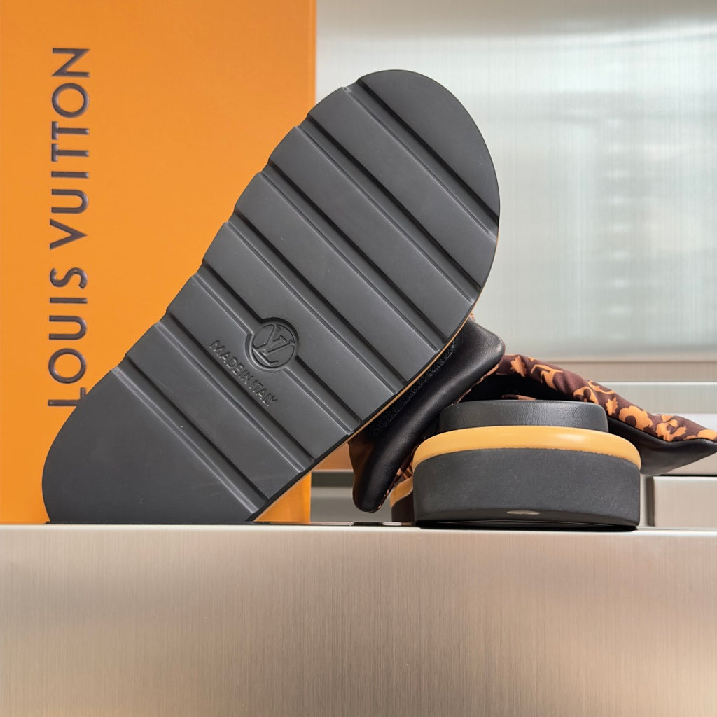 Louis Vuitton sandals with black treaded outsole and tan platform edge