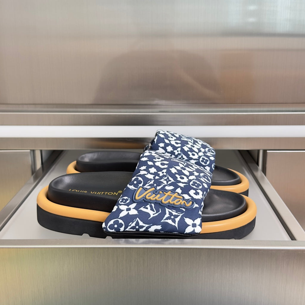 Louis Vuitton slide sandals with blue patterned straps and black footbeds, tan rubber soles