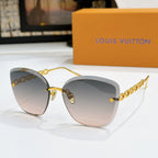 Louis Vuitton cat-eye sunglasses with smoky lenses and gold chain strap