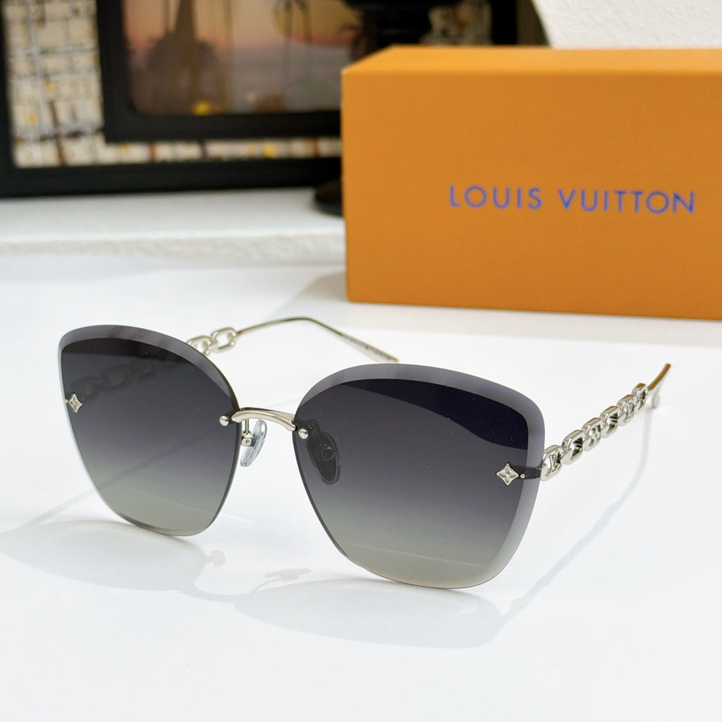 Louis Vuitton cat-eye sunglasses with dark gradient lenses and gold chain strap