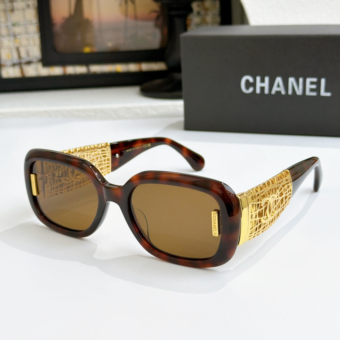 Chanel glasses with tortoise frame, gold patterned temples, and brown lenses