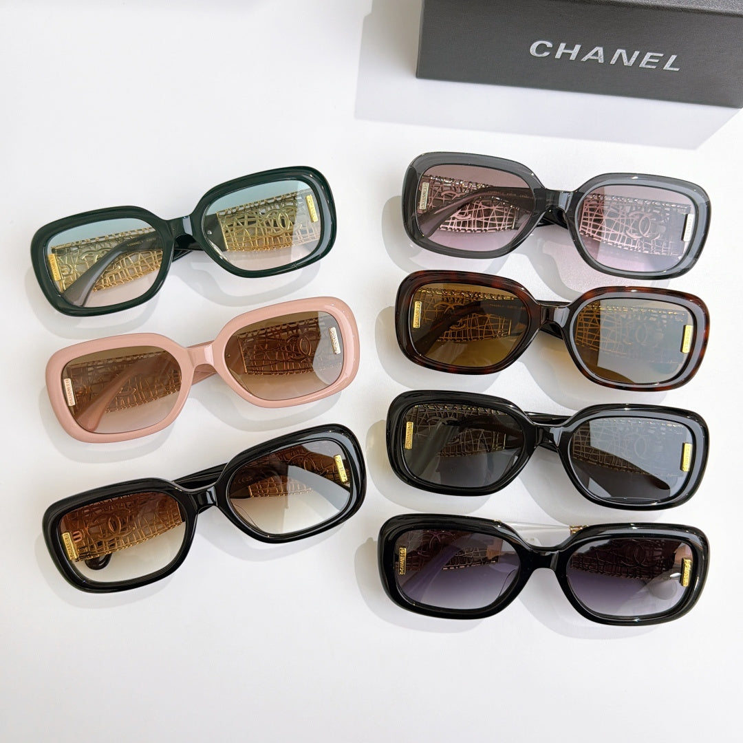 Chanel glasses assortment with black, green, pink, and tortoise frames and gold temples