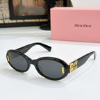 Black oval sunglasses with dark lenses and gold logo on temples