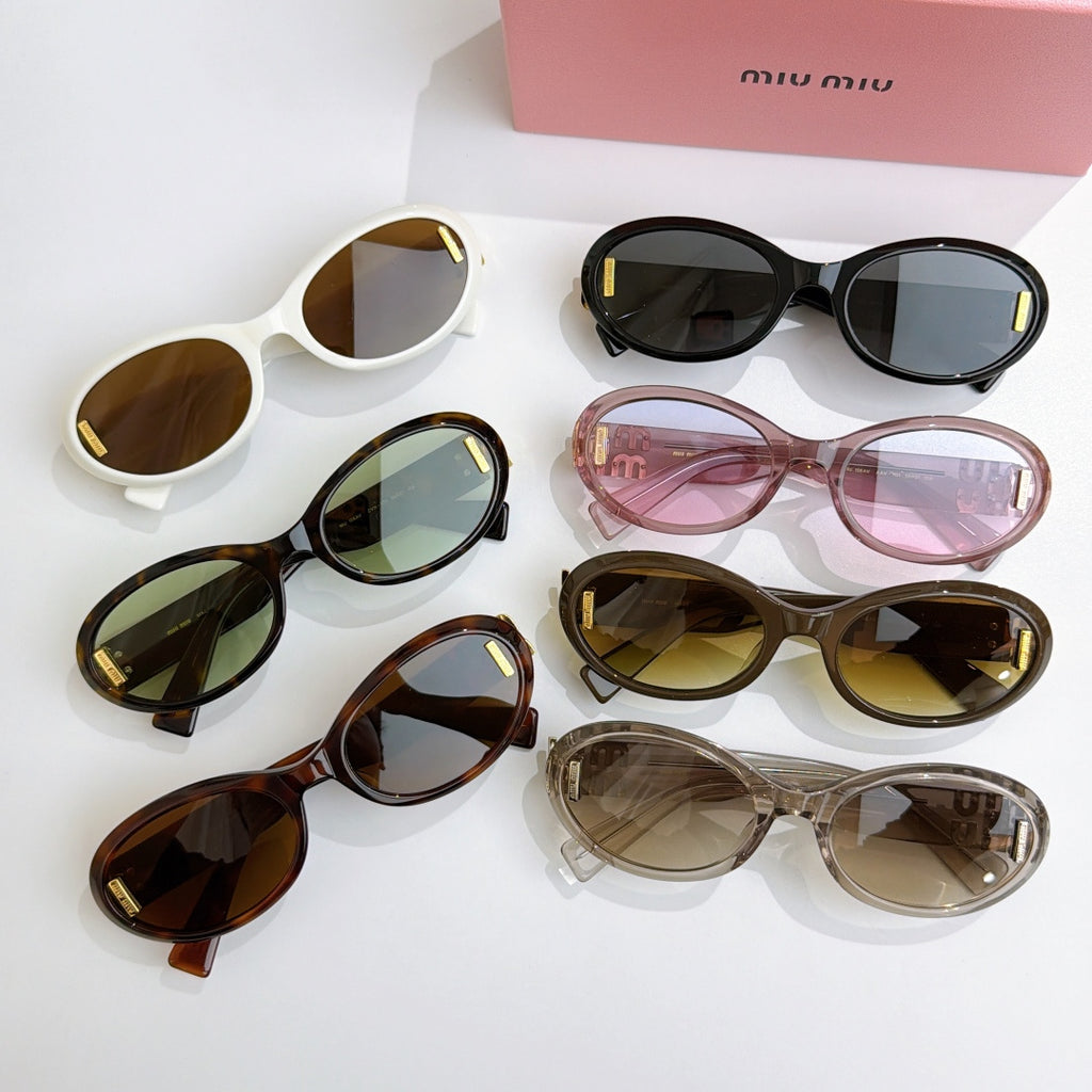 Assorted oval sunglasses with gold logo temples in white, black, pink, tortoise, and clear