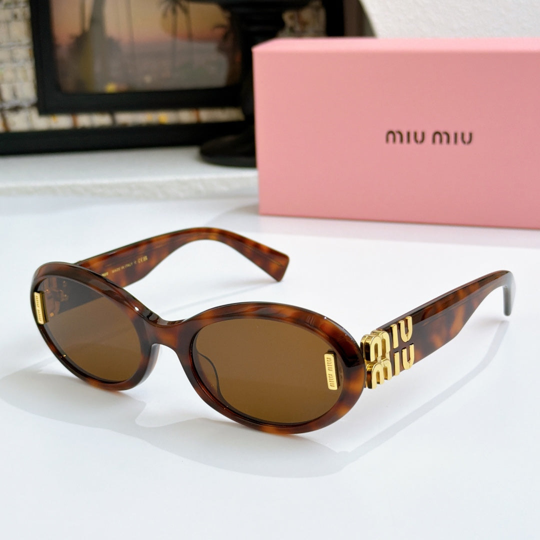Tortoise oval sunglasses with brown lenses and gold logo on temples