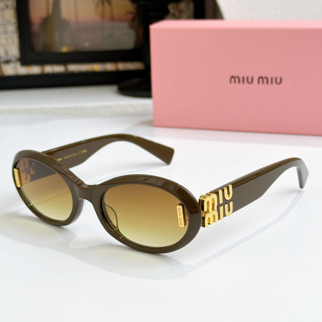 Dark olive oval sunglasses with amber lenses and gold logo on temples