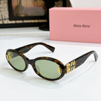 Tortoise oval sunglasses with dark green lenses and gold logo on temples