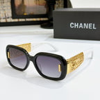 Chanel glasses with black frame, gold patterned temples, and light purple lenses