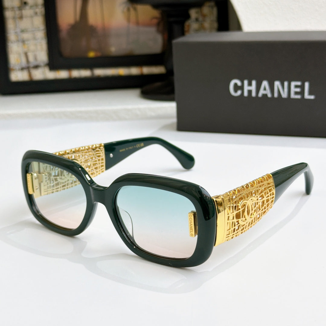 Chanel glasses with dark green frame, gold patterned temples, and light blue lenses