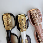Chanel glasses close-up of gold patterned temples on black and blush frames