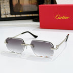 Octagonal tinted sunglasses with gold frames and smoky gray lenses, black temple tips.