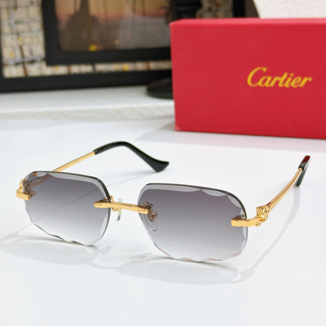 Octagonal tinted sunglasses with gold frames and dark lenses, black temple tips.