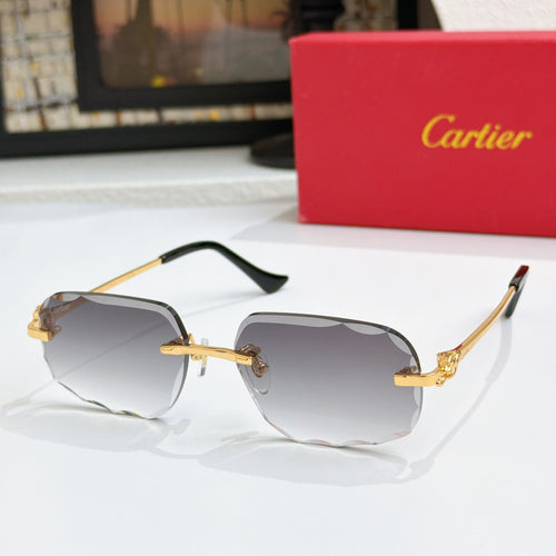 Octagonal tinted sunglasses with gold frames and dark lenses, black temple tips.