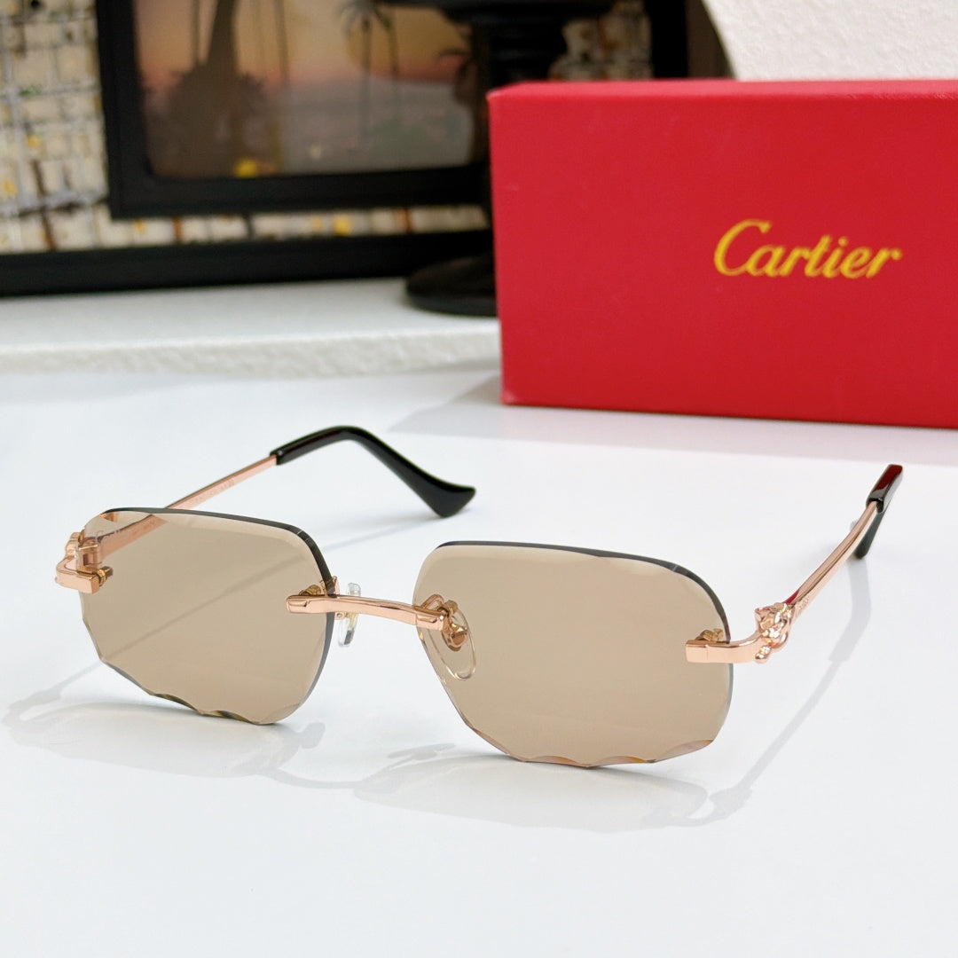 Octagonal tinted sunglasses with gold frames and tan lenses, black temple tips.