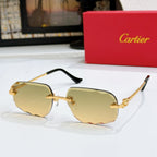 Octagonal tinted sunglasses with gold frames and amber lenses, black temple tips.