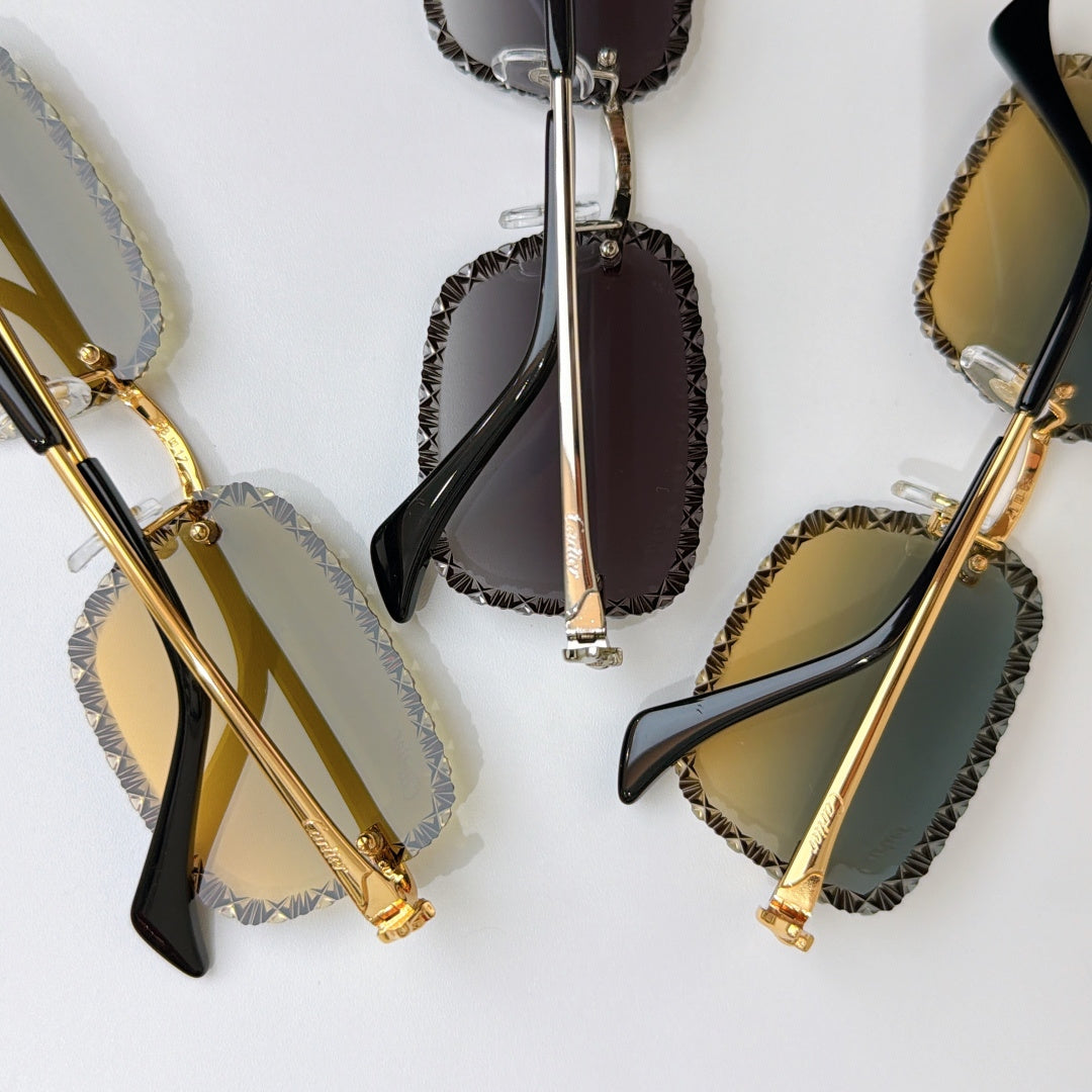 Set of gold sunglasses with tinted lenses and textured edges