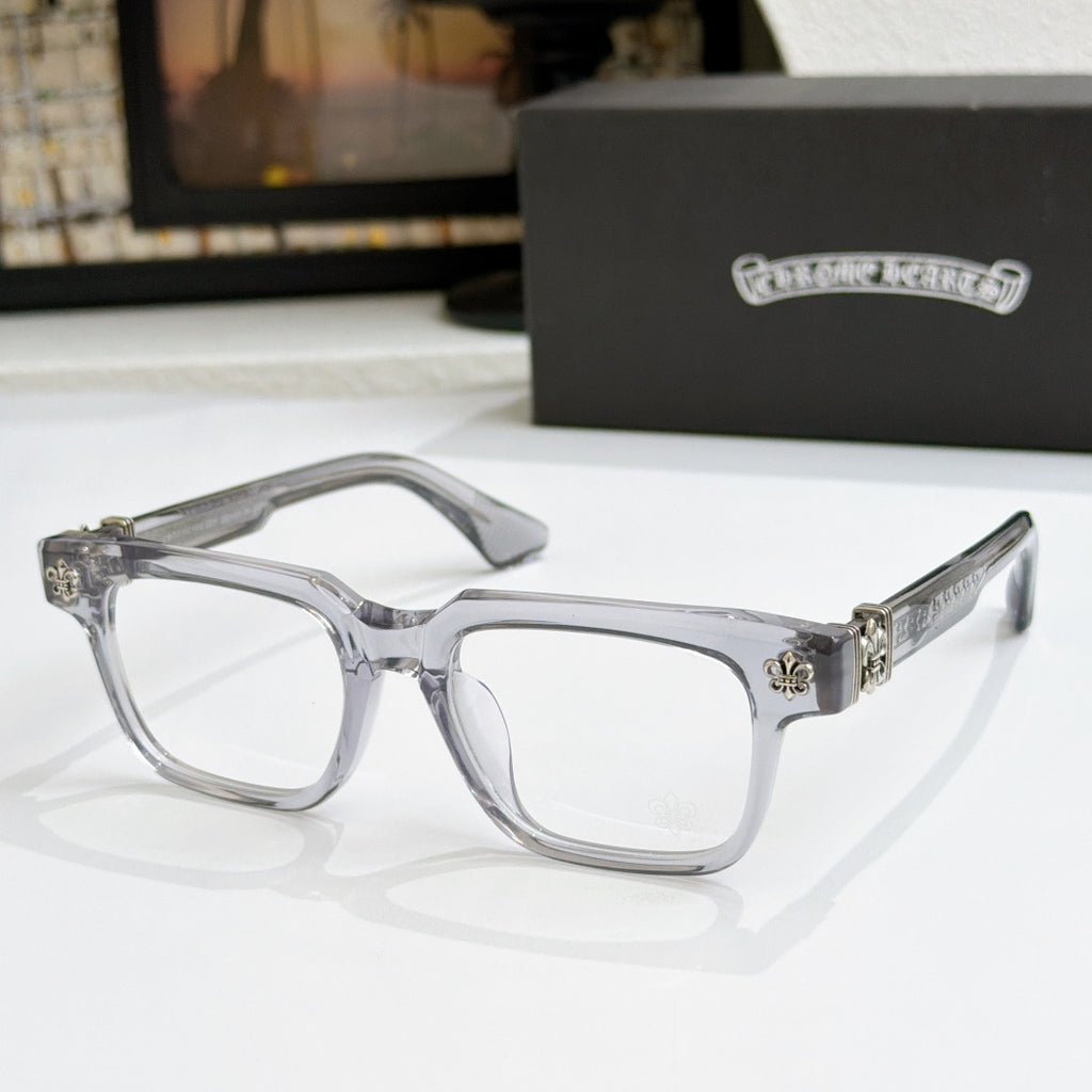 Clear frame chrome eyeglasses with silver-tone arms and small metal side emblem