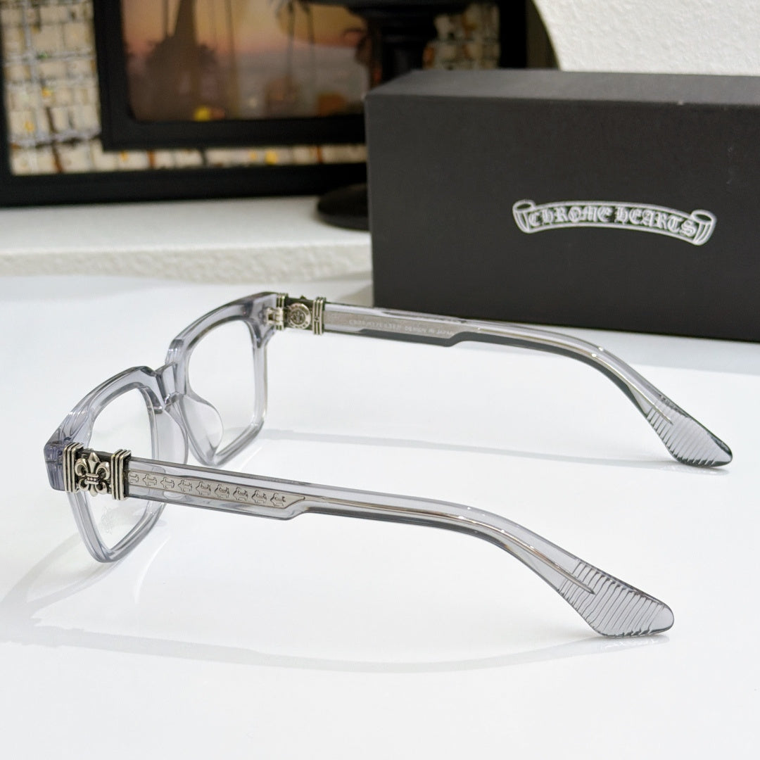 Clear chrome eyeglasses side view with textured temple and metal emblem