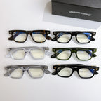 Set of chrome eyeglasses in black, green, tortoise, and clear frames, four pairs