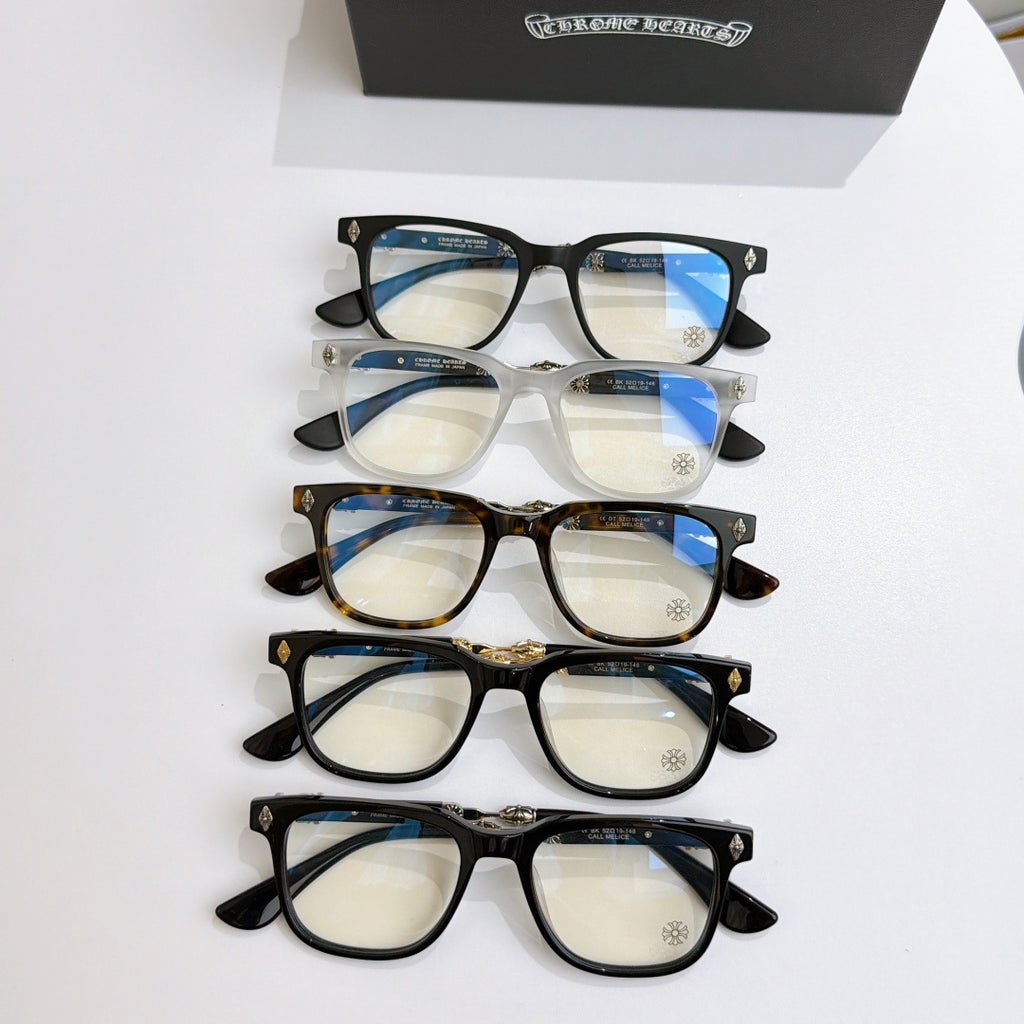 Assorted eyeglass frames: black, white, tortoise, and dark styles with blue-tinted lenses