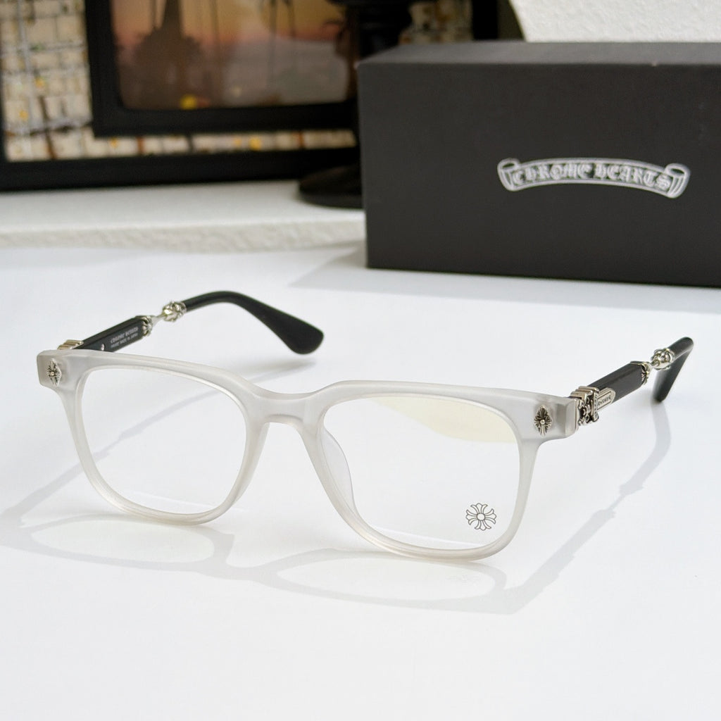 White eyeglass frames with clear lenses, gold details on hinges and temples