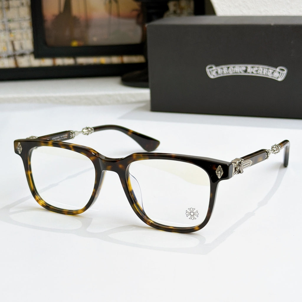 Tortoise eyeglass frames with clear lenses, gold decorative temples and bridge accents