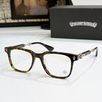 Tortoise eyeglass frames with clear lenses, gold decorative temples and bridge accents