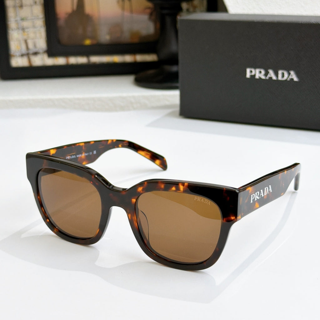 Tortoiseshell sunglasses with brown gradient lenses and dark frame detail