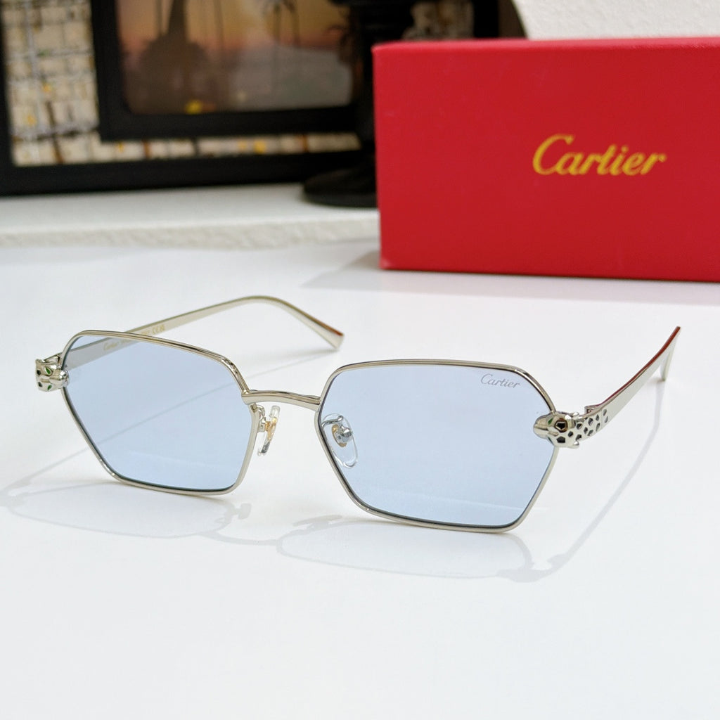 Cartier sunglasses with gold square frames and light blue lenses, angled view