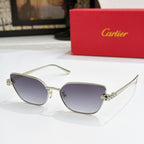Gold-tone cat-eye sunglasses with dark purple lenses and textured temple detail