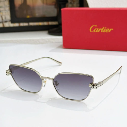 Gold-tone cat-eye sunglasses with dark purple lenses and textured temple detail