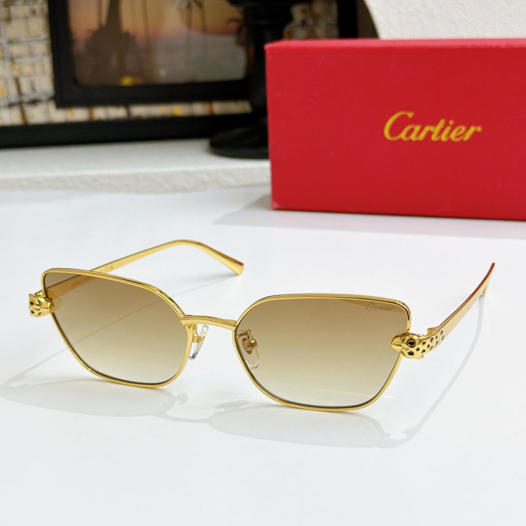Gold-tone cat-eye sunglasses with light amber gradient lenses and textured temple detail