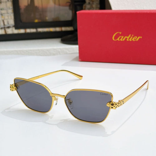 Gold-tone cat-eye sunglasses with dark gray lenses and textured temple detail