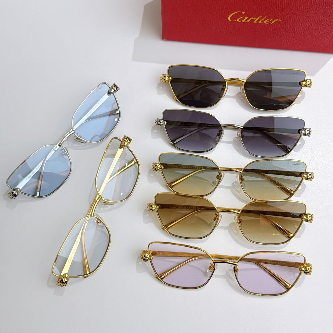 Gold-tone cat-eye sunglasses assortment with mixed lens colors on display