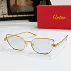 Gold-tone cat-eye sunglasses with pale lenses and textured temple detail