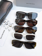 Balenciaga sunglasses stack with mixed frames and dark, square lenses