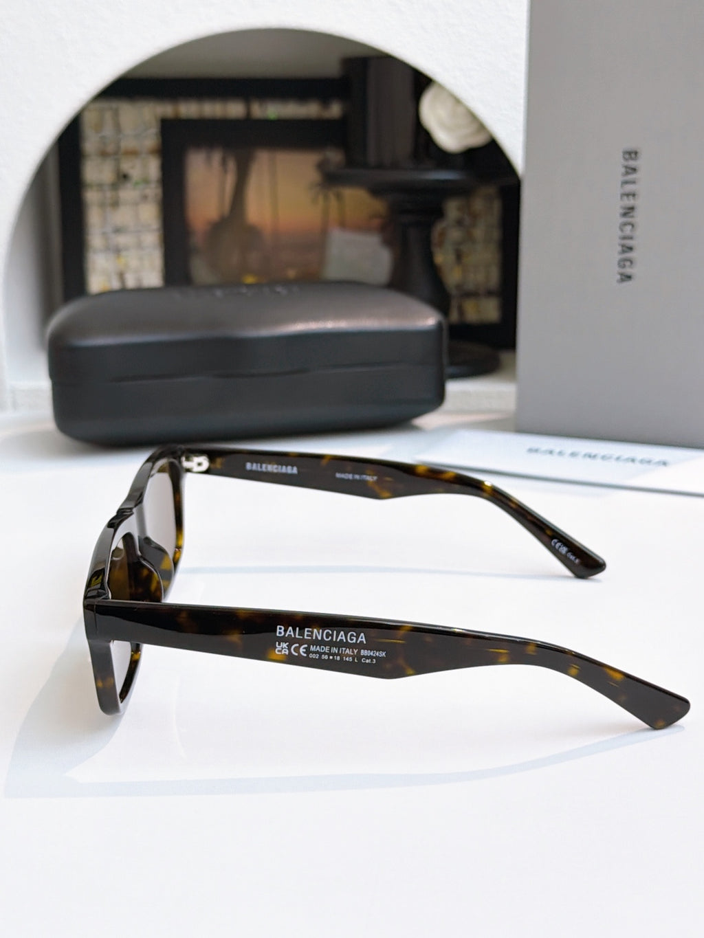 Balenciaga tortoise sunglasses with dark lenses and sleek side profiles