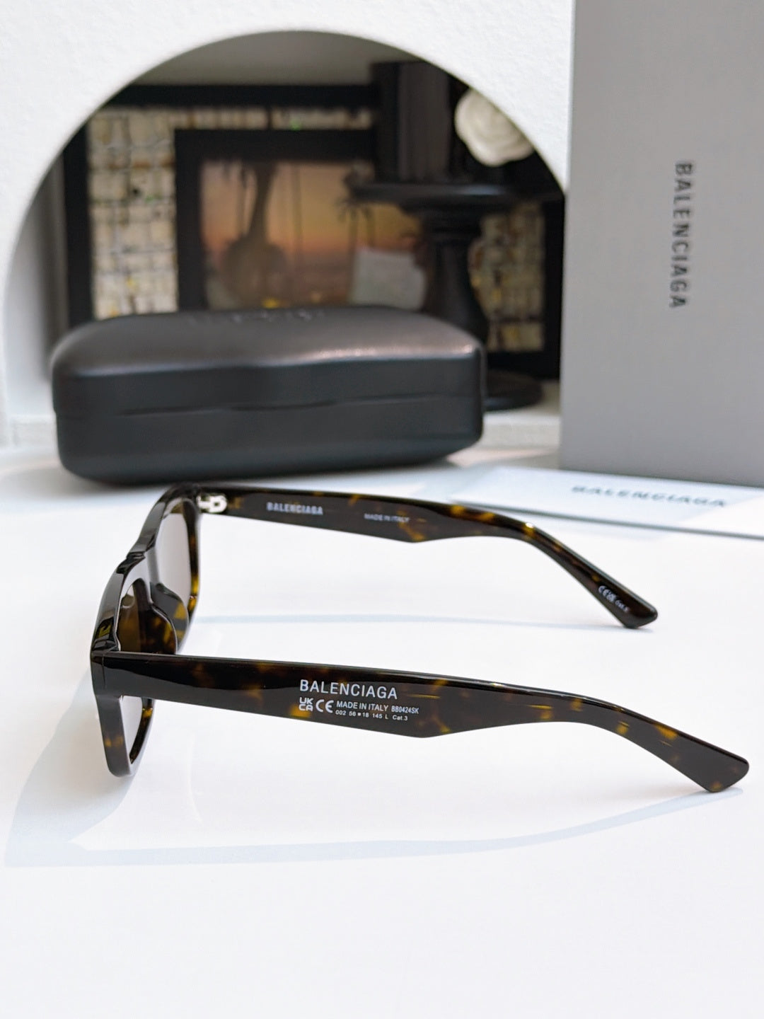 Balenciaga tortoise sunglasses with dark lenses and sleek side profiles