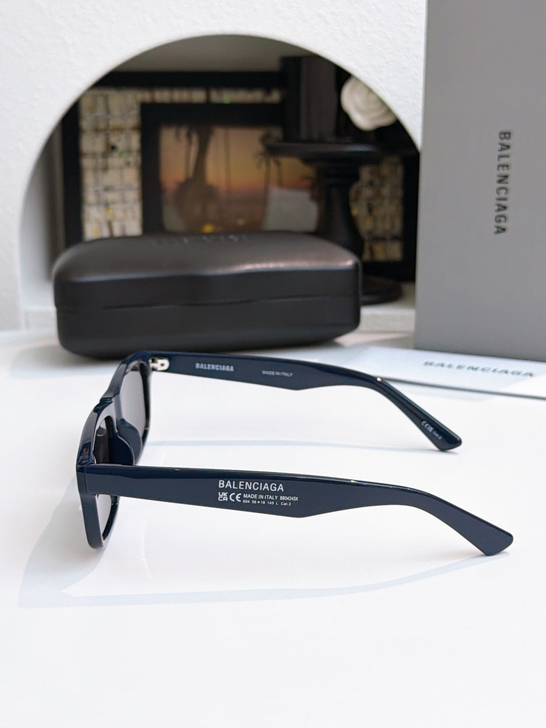Balenciaga navy sunglasses with dark lenses and slim side arms