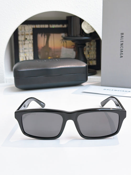 Balenciaga black square sunglasses with dark lenses and thick temples