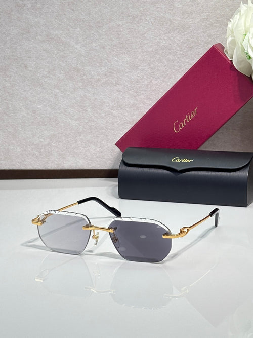 Cartier sunglasses with dark gray lenses and black frame, gold accents