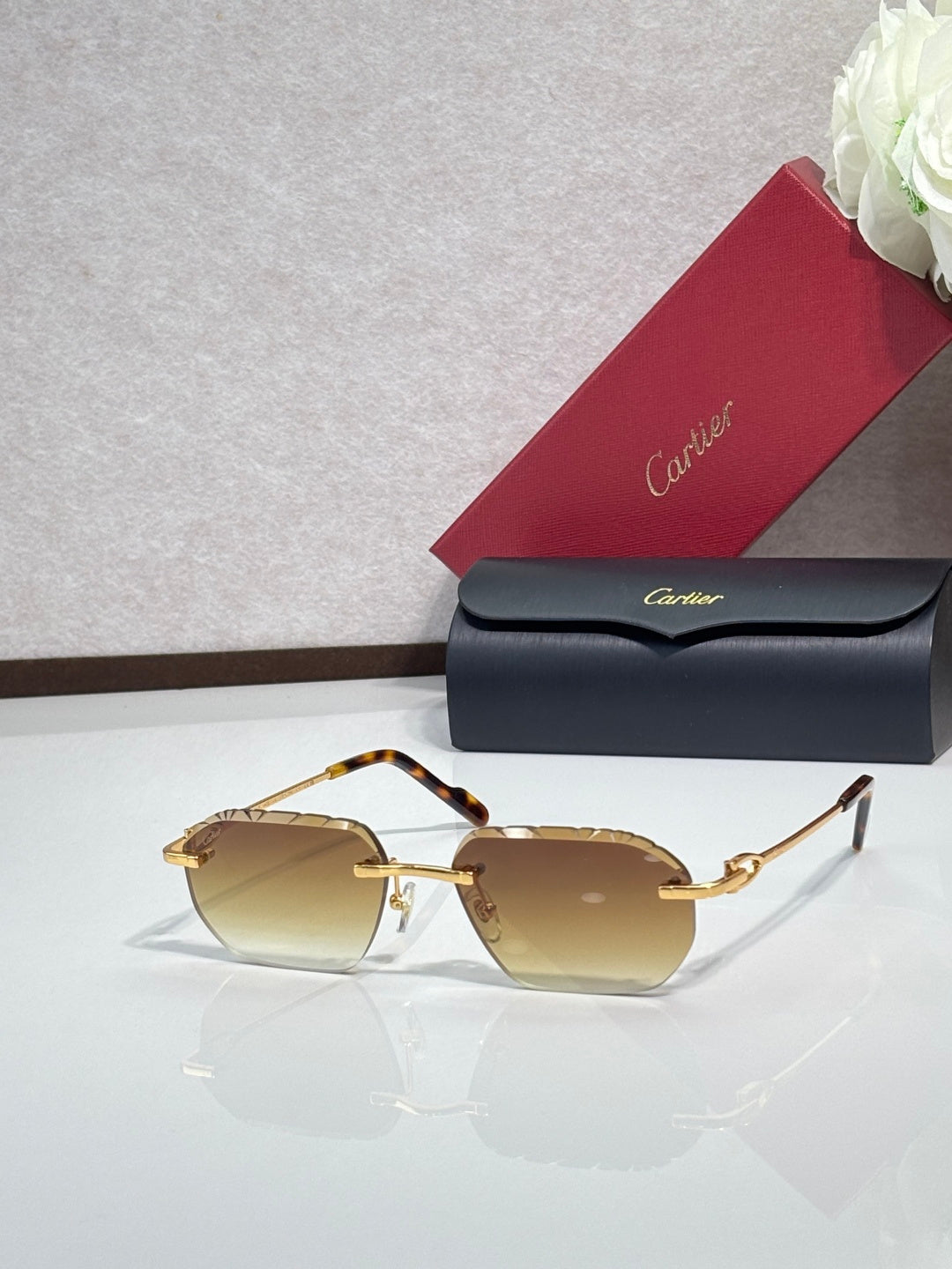 Cartier sunglasses with warm amber lenses and gold frame